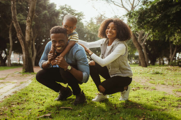 Young beautiful family in the park